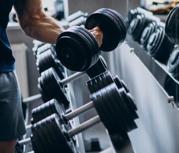 Strong man training in gym